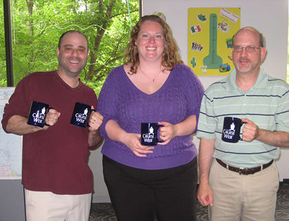 Employees showing off their new mugs! Employees showing off their new mugs!